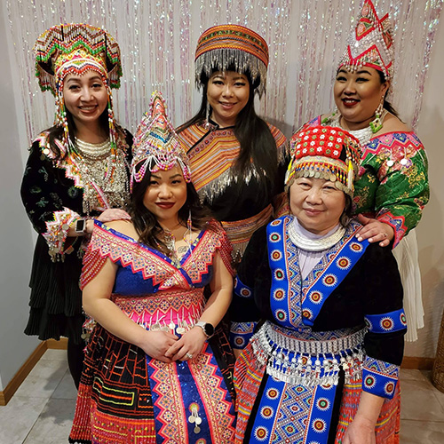 Yvonne and friends dressed in traditional Hmong clothing