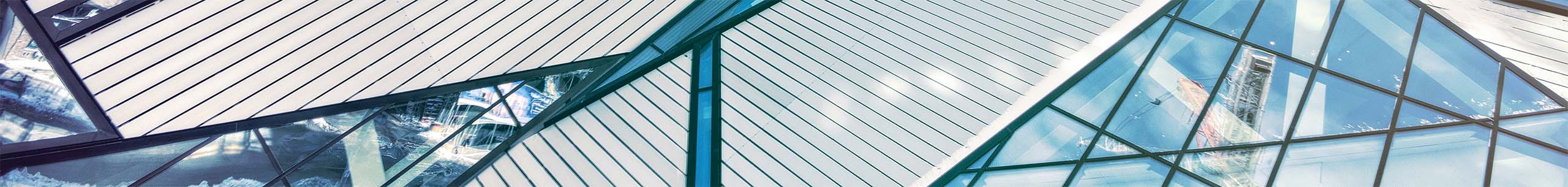 A background banner of two modern, large buildings.
